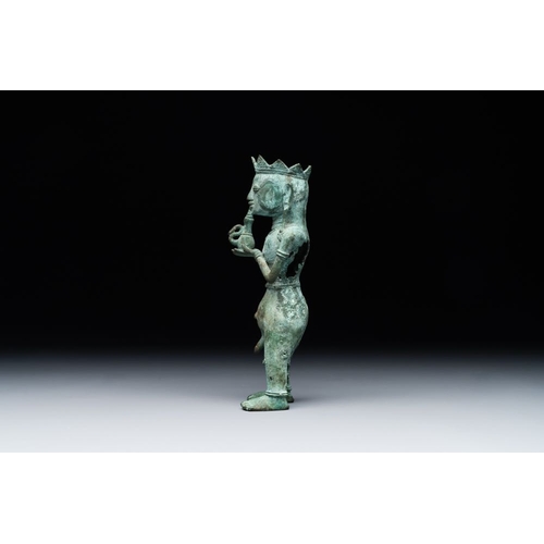 461 - An fine Indonesian bronze sculpture of a naked man offering a sacrificial vase, Majapahit, East Java... 