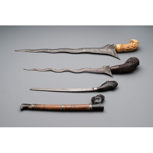 488 - A collection of six krises with carved handles, four with scabbard, Indonesia, 19th C.L.: 67 cm (the... 