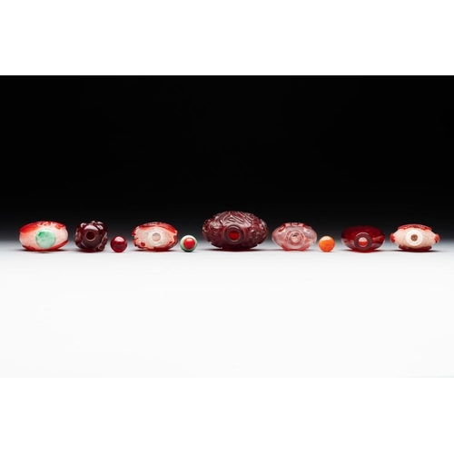 494 - A group of seven Chinese red-overlay glass and red glass snuff bottles, 19/20th C.H.: 9 cm (the tall... 