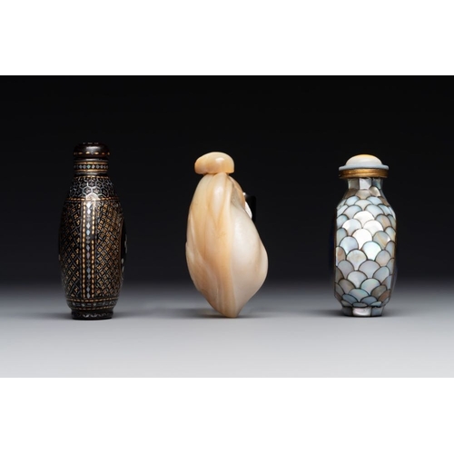 502 - Two Chinese lacquered and mother-of-pearl-inlaid snuff bottles and a carved mother-of-pearl shell sn... 