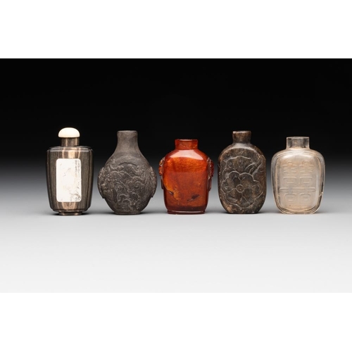 504 - Eleven Chinese snuff bottles in amber, agate, rock crystal, lacquer, hardstone, metal and wood, 19/2... 