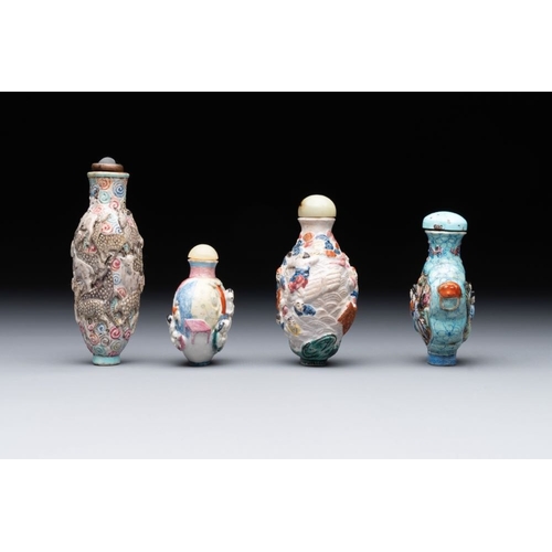 511 - Eight Chinese moulded famille rose snuff bottles, Qianlong mark, 19th C.H.: 10,5 cm (the tallest inc... 