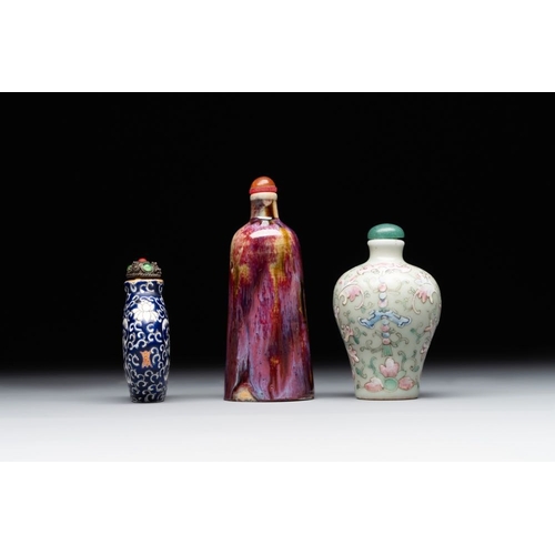 517 - Two Chinese famille rose 'lotus scroll' snuff bottles and a flambe-glazed snuff bottle, 19th C.H.: 1... 