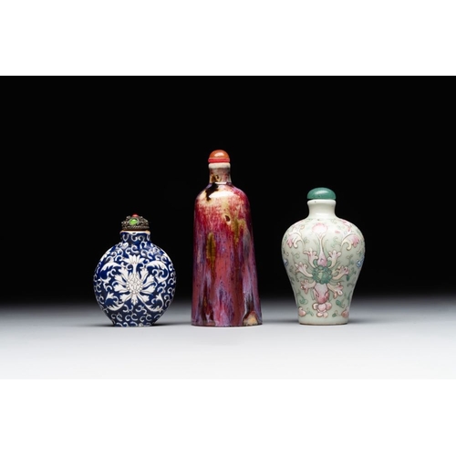 517 - Two Chinese famille rose 'lotus scroll' snuff bottles and a flambe-glazed snuff bottle, 19th C.H.: 1... 