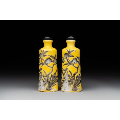 544 - A pair of Chinese grisaille yellow-ground Dayazhai-style snuff bottles, Yong Qing Chang Chun mark, 1... 