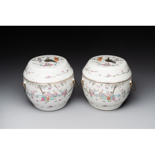 727 - A pair of Chinese famille rose jars and covers with figures in a garden, Tongzhi mark and of the per... 