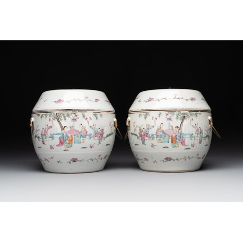 727 - A pair of Chinese famille rose jars and covers with figures in a garden, Tongzhi mark and of the per... 