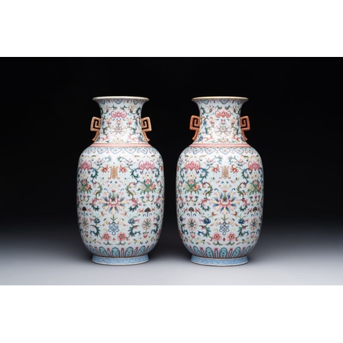 733 - A pair of Chinese famille rose vases with floral design, Jiaqing mark, 19/20th C.H.: 28 cmThe absenc... 