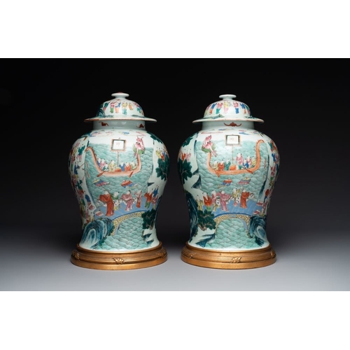 748 - A pair of Chinese famille rose 'hundred boys' vases and covers on wooden stands, 19th C.H.: 44 cm (t... 