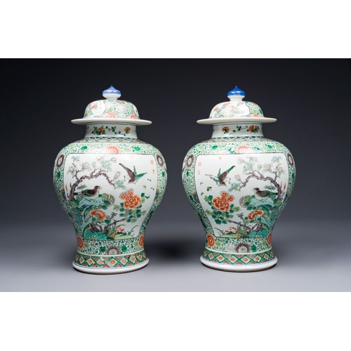 749 - A pair of Chinese famille verte 'bird and flower' vases and covers, Kangxi mark, 19th C.H.: 43 cm (i... 