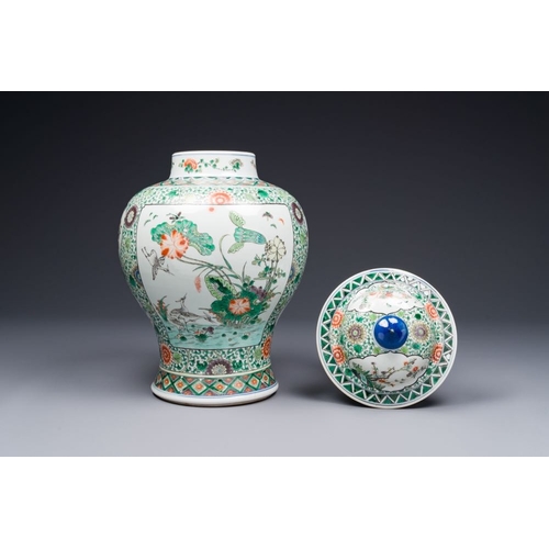 749 - A pair of Chinese famille verte 'bird and flower' vases and covers, Kangxi mark, 19th C.H.: 43 cm (i... 