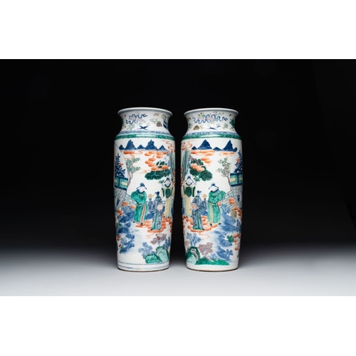 753 - A pair of Chinese famille verte rouleau vases with narrative design, 19th C.H.: 45,5 cmThe absence o... 