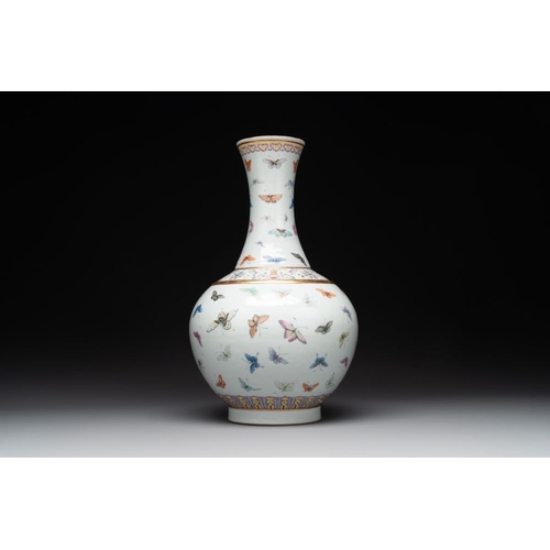 777 - A Chinese famille rose 'butterfly' bottle vase, Guangxu mark and of the periodH.: 39,5 cmThe absence... 