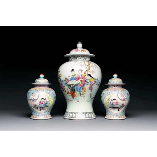 799 - A Chinese famille rose covered vase and a pair of small covered vases, Qianlong mark, 20th C.H.: 52 ... 