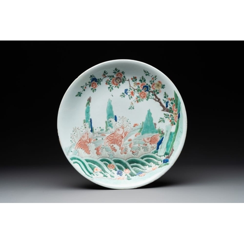 822 - A Chinese famille verte 'leaping carps' dish, artemisia leaf mark, KangxiDia.: 35,5 cmThe absence of... 