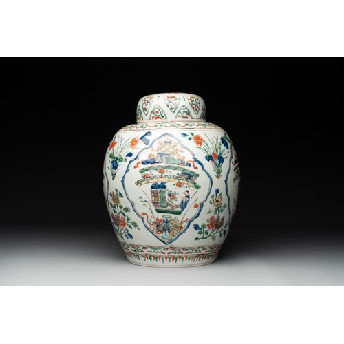 832 - A Chinese famille verte 'figures and antiquities' jar and cover, KangxiH.: 27,5 cm The absence of a ... 