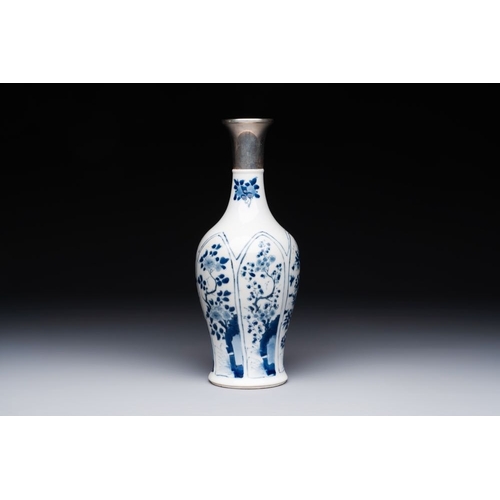 882 - A Chinese blue and white silver-mounted vase with floral design, KangxiH.: 26,5 cm (incl. mount)The ... 