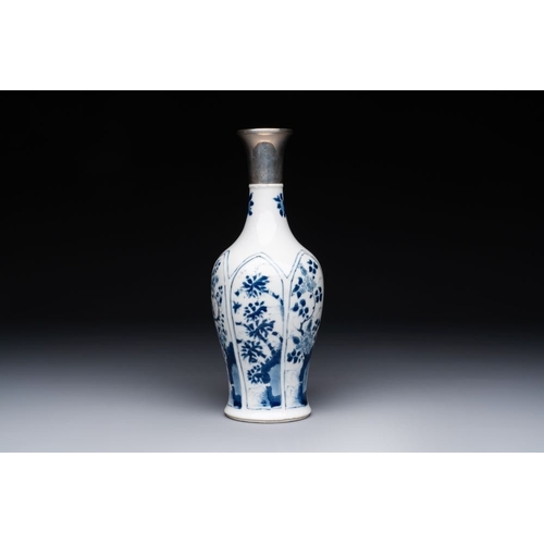 882 - A Chinese blue and white silver-mounted vase with floral design, KangxiH.: 26,5 cm (incl. mount)The ... 