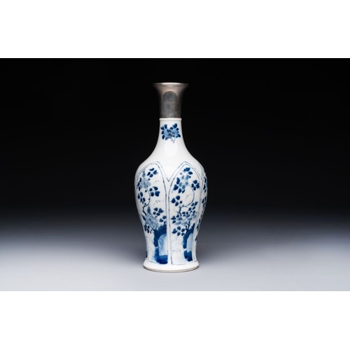 882 - A Chinese blue and white silver-mounted vase with floral design, KangxiH.: 26,5 cm (incl. mount)The ... 