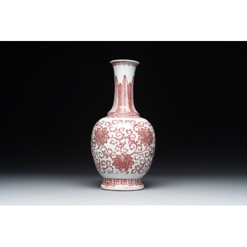 926 - A Chinese copper-red-decorated 'lotus scroll' bottle vase, QianlongH.: 34,3 cmThe absence of a condi... 