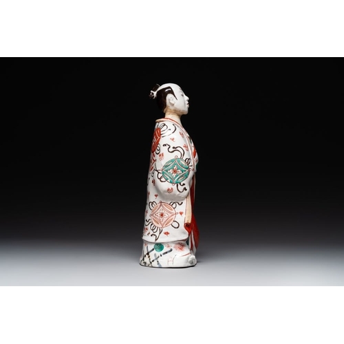 932 - A Japanese Imari figure of a Bijin, Edo, 1st half 18th C.H.: 37 cmThe absence of a condition report ... 