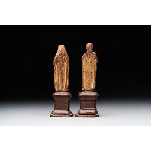 975 - Two parcel-gilt and polychromed miniature oak sculptures of Saint John The Evangelist and Saint Cath... 