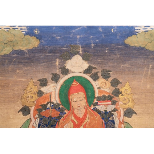 1055 - A Tibetan thangka depicting a lama, 19th C.Dim.: 120 x 43,8 cm (the mount)Dim.: 42,2 x 29,2 cm (the ... 