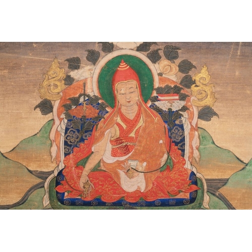 1055 - A Tibetan thangka depicting a lama, 19th C.Dim.: 120 x 43,8 cm (the mount)Dim.: 42,2 x 29,2 cm (the ... 