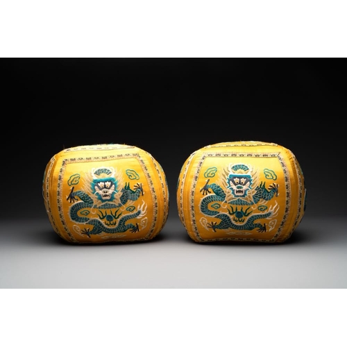 1061 - A pair of Chinese yellow-ground embroidered silk 'dragon' cushions, 19th C.Dim.: 27 x 27 x 24 cm... 