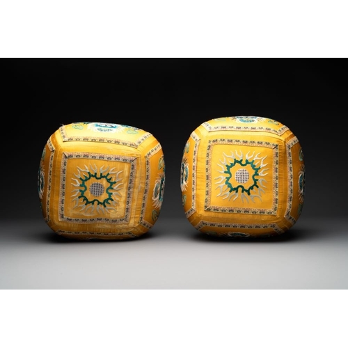 1061 - A pair of Chinese yellow-ground embroidered silk 'dragon' cushions, 19th C.Dim.: 27 x 27 x 24 cm... 