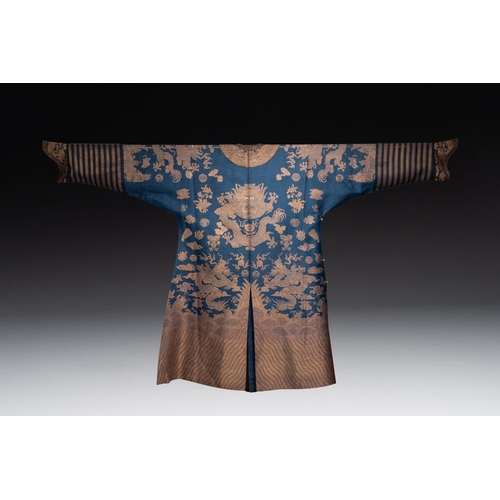 1064 - A Chinese embroidered silk blue-ground summer gauze 'nine dragons' robe, 19th C.Dim.: 215 x 130 cm... 