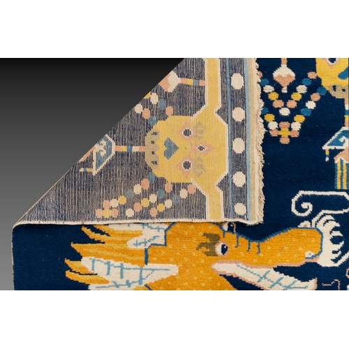 1065 - A Chinese woollen 'dragon' pillar carpet, 19th C.Dim.: 378 x 120 cm
Many Chinese Buddhist objects fr... 