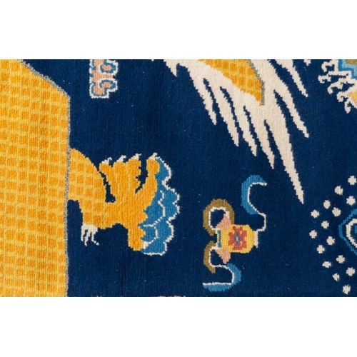 1065 - A Chinese woollen 'dragon' pillar carpet, 19th C.Dim.: 378 x 120 cm
Many Chinese Buddhist objects fr... 