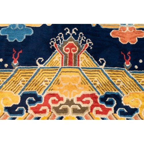 1066 - A Chinese inscribed woollen 'dragon' pillar carpet, 19th C.Dim.: 473 x 141 cm
Many Chinese Buddhist ... 