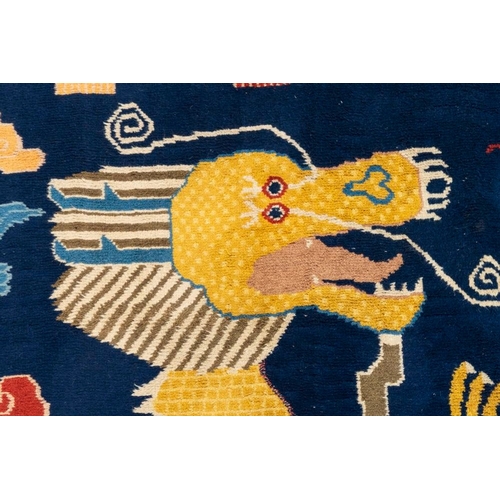 1066 - A Chinese inscribed woollen 'dragon' pillar carpet, 19th C.Dim.: 473 x 141 cm
Many Chinese Buddhist ... 