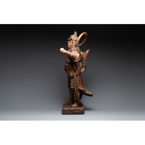 1068 - A large Chinese polychrome-lacquered wooden figure of a Guardian King, 18/19th C.H.: 91 cm
... 