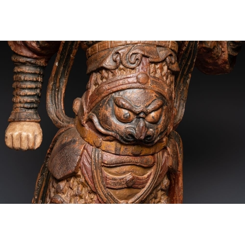 1068 - A large Chinese polychrome-lacquered wooden figure of a Guardian King, 18/19th C.H.: 91 cm
... 