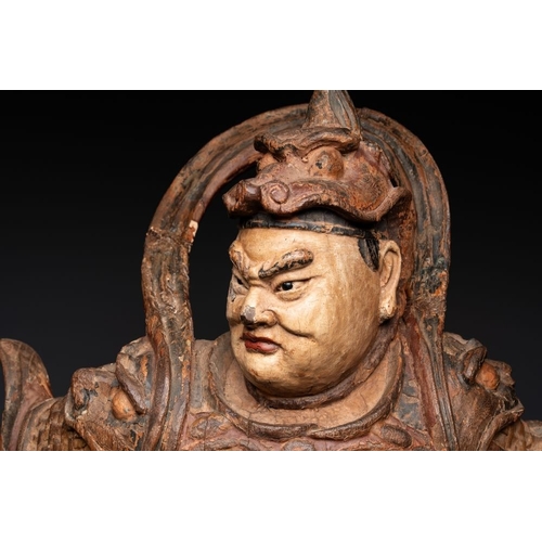 1068 - A large Chinese polychrome-lacquered wooden figure of a Guardian King, 18/19th C.H.: 91 cm
... 