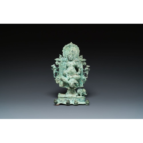 1082 - A bronze group with Kubera on throne, Central Java, Indonesia, 11/12th C.H.: 31 cm
Weight: 2638 gram... 