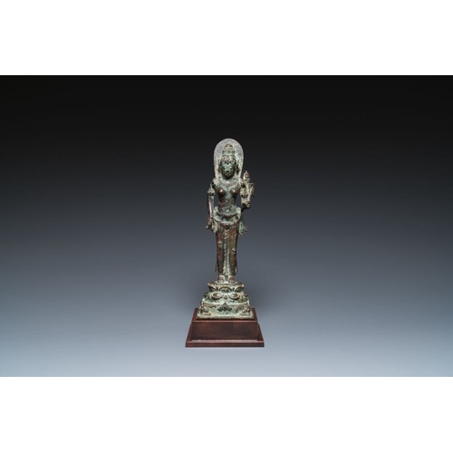 1083 - A Javanese bronze Majapahit sculpture of the goddess Dewi Tara, Indonesia, probably 14th C.H.: 33 cm... 