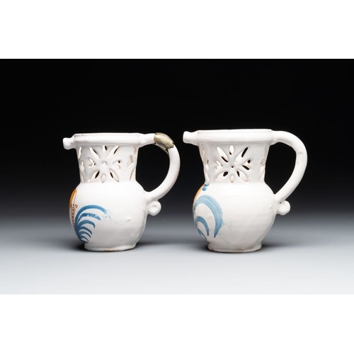 1131 - Three French white-glazed and two polychrome puzzle jugs, Nevers, 18th C.H.: 18,4 cm (the tallest)H.... 