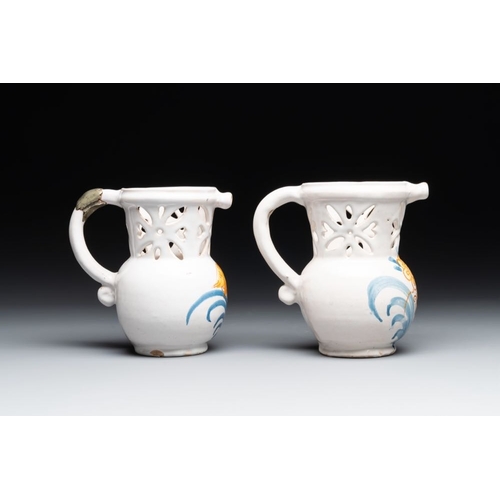 1131 - Three French white-glazed and two polychrome puzzle jugs, Nevers, 18th C.H.: 18,4 cm (the tallest)H.... 