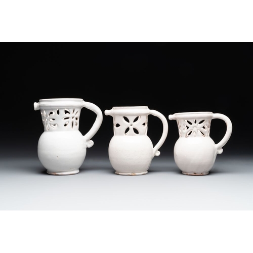 1131 - Three French white-glazed and two polychrome puzzle jugs, Nevers, 18th C.H.: 18,4 cm (the tallest)H.... 