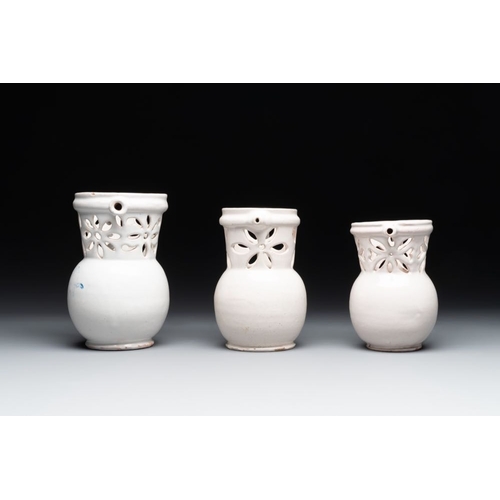 1131 - Three French white-glazed and two polychrome puzzle jugs, Nevers, 18th C.H.: 18,4 cm (the tallest)H.... 