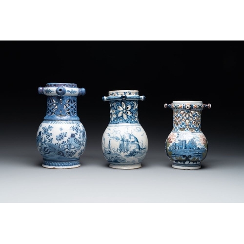 1132 - Two blue and white and one polychrome Dutch Delft puzzle jugs, dated 1734 and 1705, 18th C. and late... 