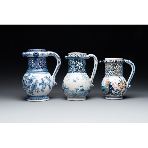 1132 - Two blue and white and one polychrome Dutch Delft puzzle jugs, dated 1734 and 1705, 18th C. and late... 