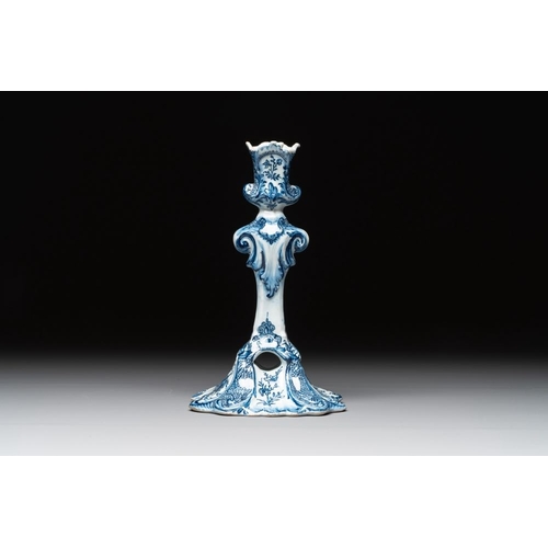 1148 - A Dutch Delft blue and white candle holder, 18th C.H.: 21,5 cm
Marked on the base with an axe for 