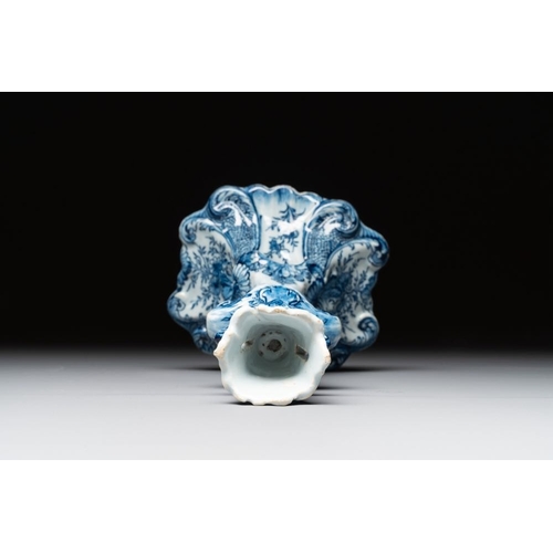 1148 - A Dutch Delft blue and white candle holder, 18th C.H.: 21,5 cm
Marked on the base with an axe for 