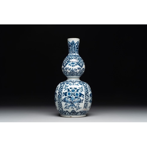 1150 - A Dutch Delft blue and white double gourd vase, Pieter Kam, ca. 1700H.: 28,5 cm
Marked PK for Pieter... 