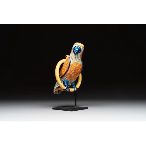 1154 - A polychrome Dutch Delft parrot on a later metal stand, 18/19th C.H.: 26,5 cm